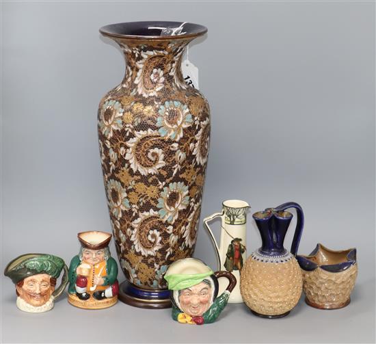 A Doulton Slaters patent vase, a jug, a pot, a Noke series ware jug and three character jugs